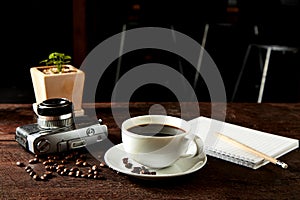 Coffee camera and smartphone on wooden table