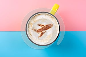 Coffee cappuccino with a picture of the airplane on the foam, top view. Pastel bright background. Concept of air travel.