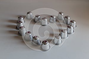 Coffee capsules silhouetting a heart