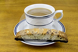 coffee with a chocolate biscotti