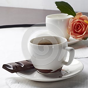 Coffee with chocolate and rose