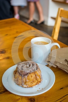 Coffee and Cinnamon Bun in Cafe