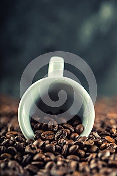Coffee. Coffee beans. Coffee cup full of coffee beans. Toned image