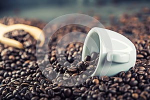 Coffee. Coffee beans. Coffee cup full of coffee beans. Toned image