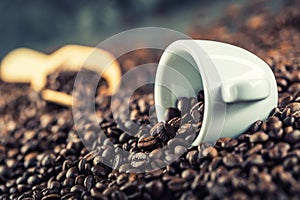 Coffee. Coffee beans. Coffee cup full of coffee beans. Toned image
