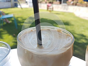 Coffee cold frape in greece summer season in a yard photo