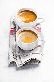 Coffee composition on white marble table