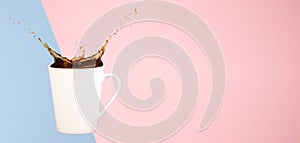 Coffee concept. Minimal art. Solid background. Coffee splashes. Levitating mug