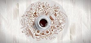 Coffee concept on wooden background - white coffee cup, top view with doodle illustration about coffee, beans, morning