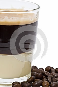 Coffee with condensed milk and coffee beans.