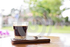 Coffee with condensed milk. Coffee with condensed milk in a transparent glass.Vietnamese coffee with condensed milk in glass cups.