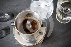 Coffee with condensed milk and ice cubes.