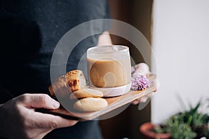 Coffee with cookies on a wooden plate