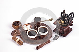 Coffee in copper coasters with accessories for coffee-drinking o