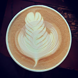 Coffee with a cream leaf