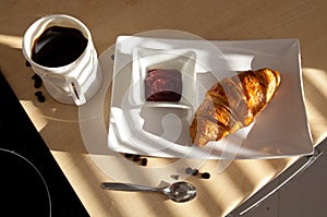 Coffee, croissant and jam - french breakfast