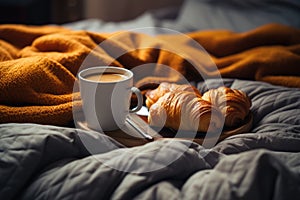 Coffee with croissants in bed