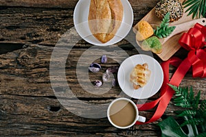 Coffee, croissants, cinnamon rolls and berries breakfast.