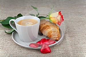 Coffee, croissants, heart chocolate, roses