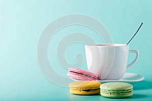 Coffee cup on aqua background with place for an inscription