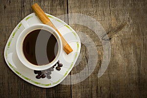 Coffee Cup with beans and cinnamon stick