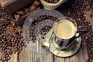 Coffee cup and beans, coffee grinder and sack