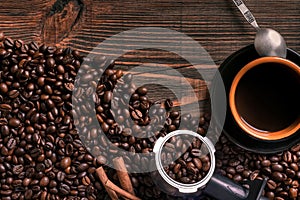 Coffee cup and beans frame on wooden table