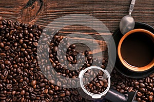 Coffee cup and beans frame on wooden table