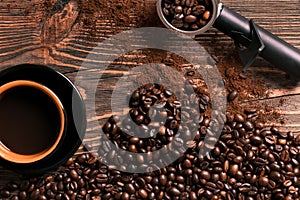 Coffee cup and beans frame on wooden table
