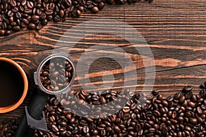 Coffee cup and beans frame on wooden table