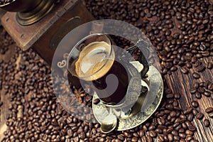 Coffee cup and beans, old coffee grinder