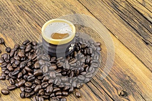 Coffee cup beans pile aroma wood background copy space
