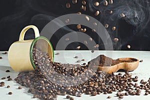 Coffee cup and beans spread and ground coffee in a wooden bowl on a white background