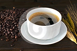 Coffee Cup and Beans on Wooden Table