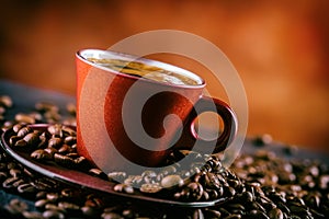 Coffee. Cup of black coffee and spilled coffee beans. Coffee break