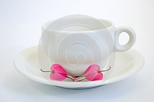 Coffee cup with bleeding heart flower