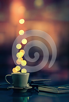 Coffee cup and blurred lights