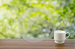 Coffee cup in bokeh background