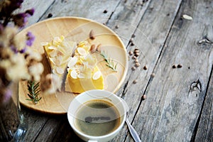 Coffee cup and cake on plate