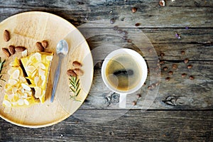 Coffee cup and cake on wooden