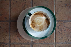Coffee cup on ceramic table