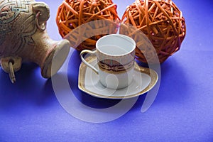 Coffee cup and clay vessel background