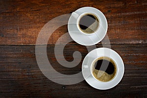 coffee cup clock and news paper on old wooden table nature background