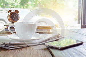 coffee cup clock and work on table