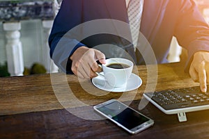 coffee cup clock and work on table