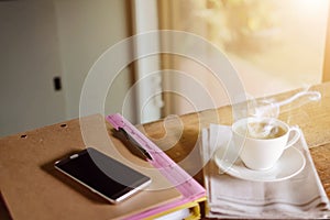 coffee cup clock and work on table