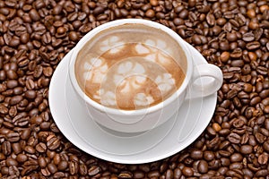 Coffee cup with coffee beans