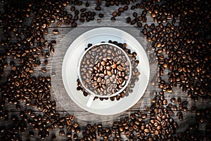 Coffee cup with coffee beans.