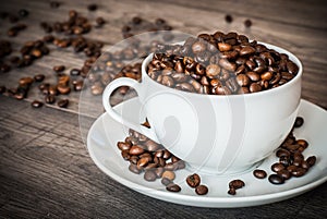 Coffee cup with coffee beans.