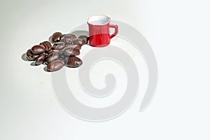Coffee cup on coffee beans background.